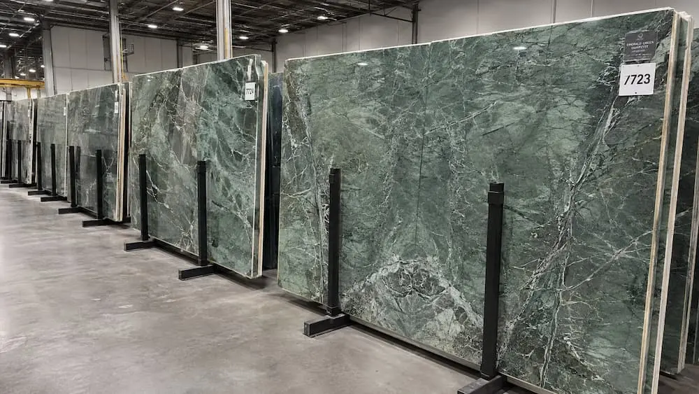 Numbered Amazon Green quartzite slabs prepared for comparison and buyer approval