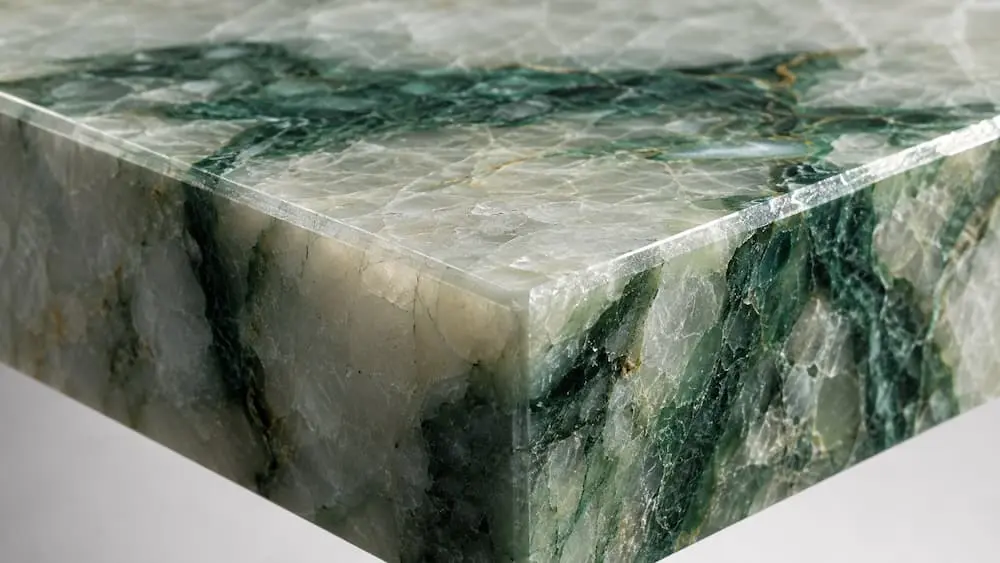 Polished mitered edge detail on fabricated Amazon Green quartzite