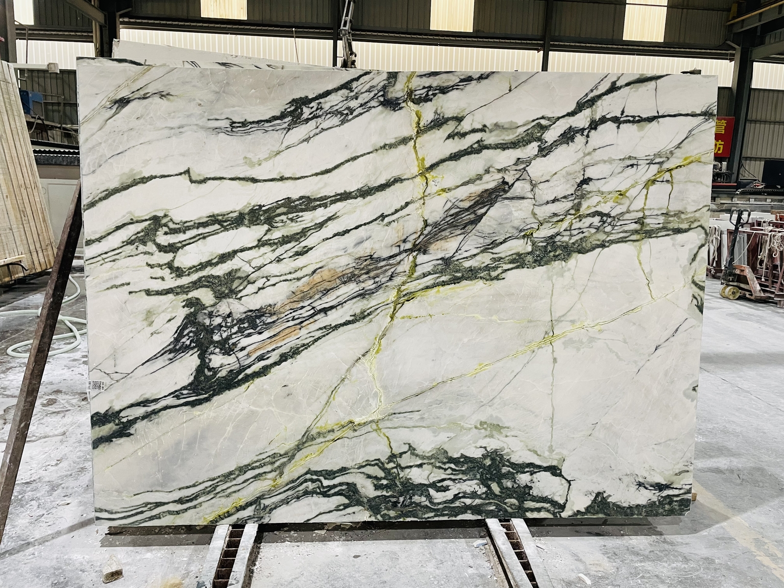 Polished Clivia Marble Finish Polished Clivia Marble showing enhanced green veins and light marble background