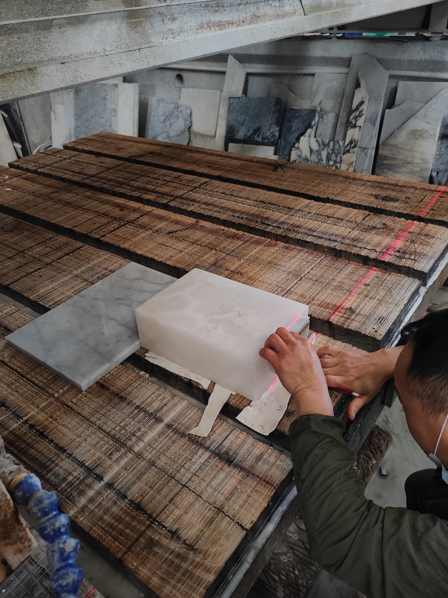 White Onyx Machine Processing White Onyx undergoing machine processing for custom vanity and panel fabrication