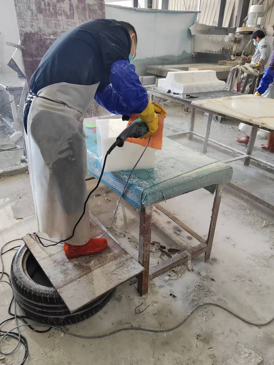 White Onyx Polishing White Onyx during polishing and surface quality inspection in stone fabrication